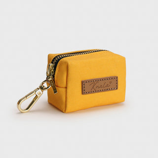 Knala Honey Yellow dog waste bag holder front view on a white background.